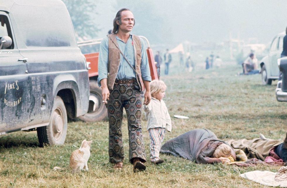 Image: Ralph Ackerman / Time Life Pictures / Getty Images - Walking Through Woodstock, sleeping sleeping bags on the ground, Alice's Restaurant vintage delivery van