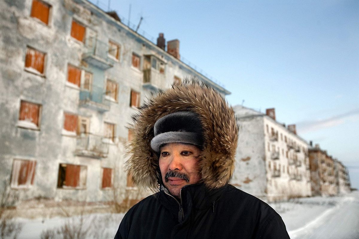 Karp Belgayev, a coal miner, walks through Yor Shor, an abandoned village near Vorkuta where he is among the last ten inhabitants. Miners say that after ten years working underground it is impossible to remove black rings from around the eyes. Vorkuta is a coal mining and former Gulag town 1,200 miles north east of Moscow, beyond the Arctic Circle, where temperatures in winter drop to -50C. Here, whole villages are being slowly deserted and reclaimed by snow.